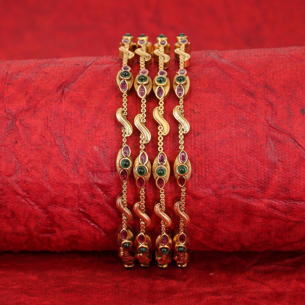 Vintage-inspired antique bangles with ornate curved detailing