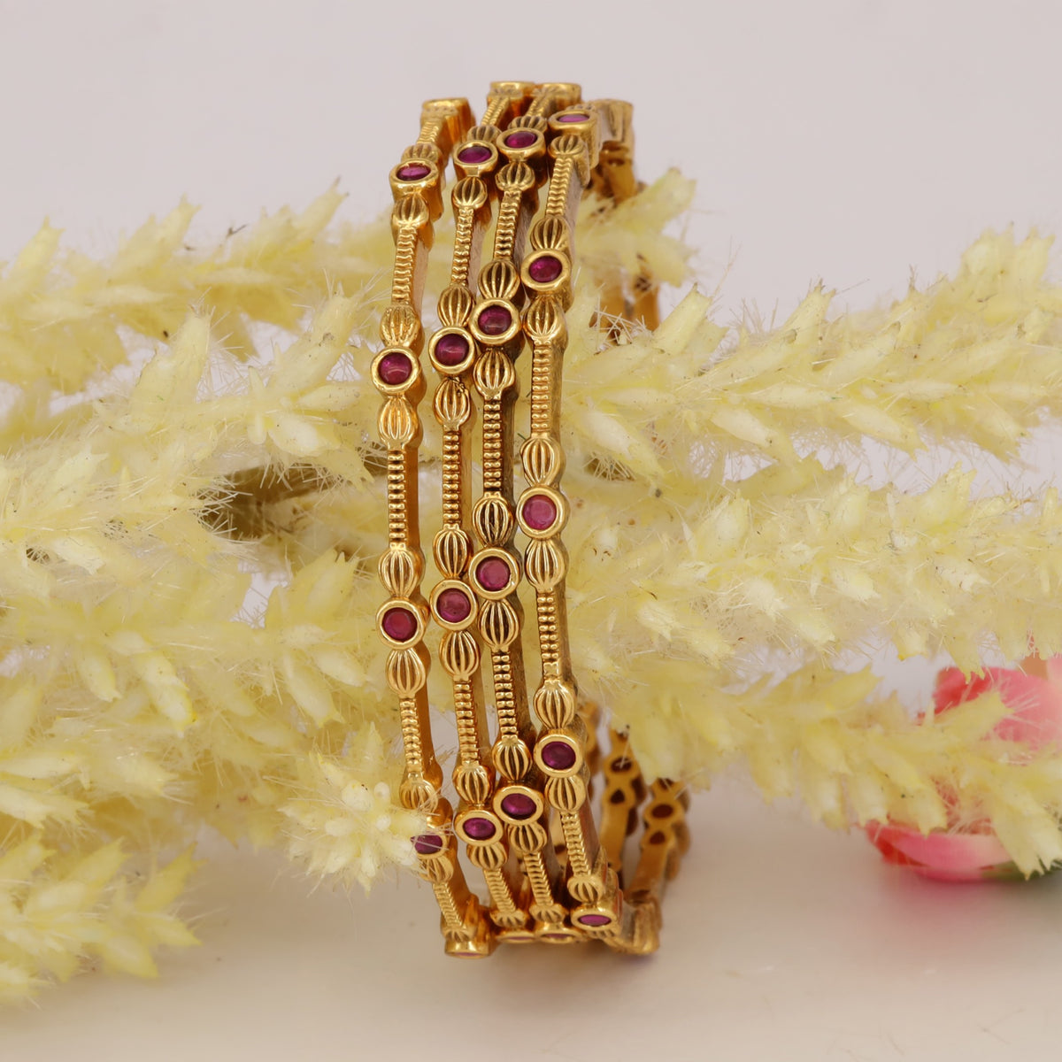 Classic antique bangles with sculpted floral-inspired detailing
