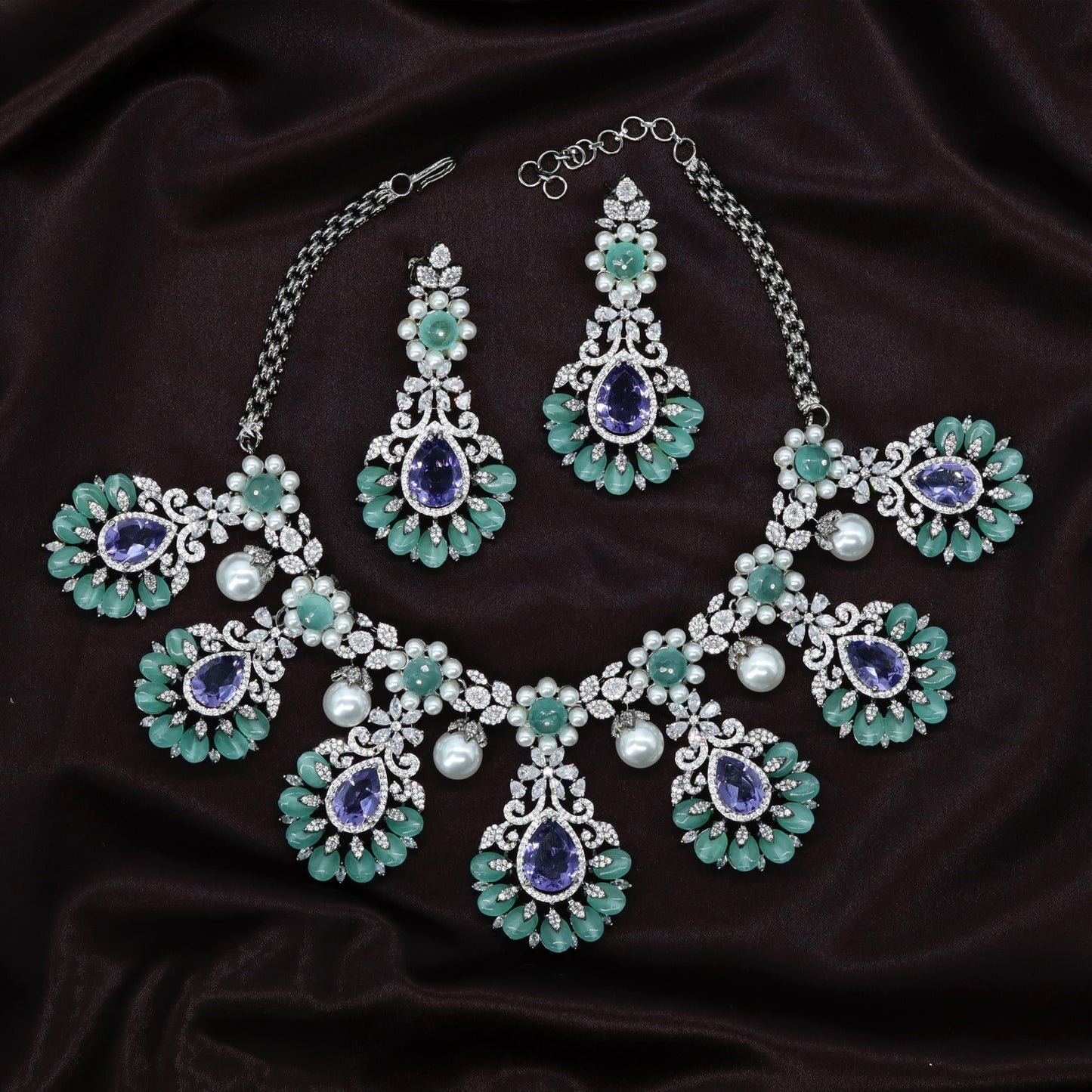 Occasion Crystal Necklace Built Around Graduated Teardrop Pendants and Ornate Floral Details