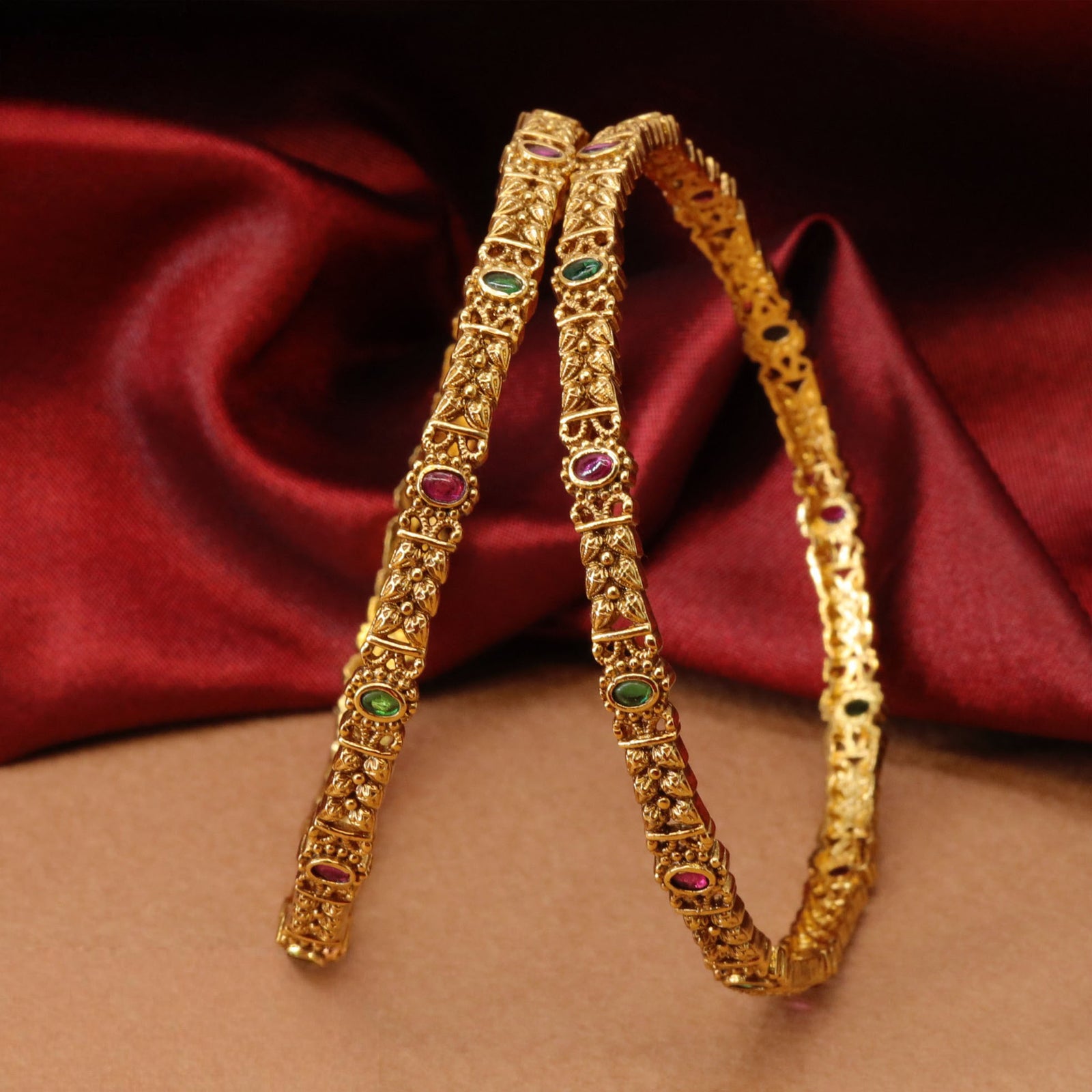 Structured Panel Work Bangles with Intricate Carved Segments and Accent Settings