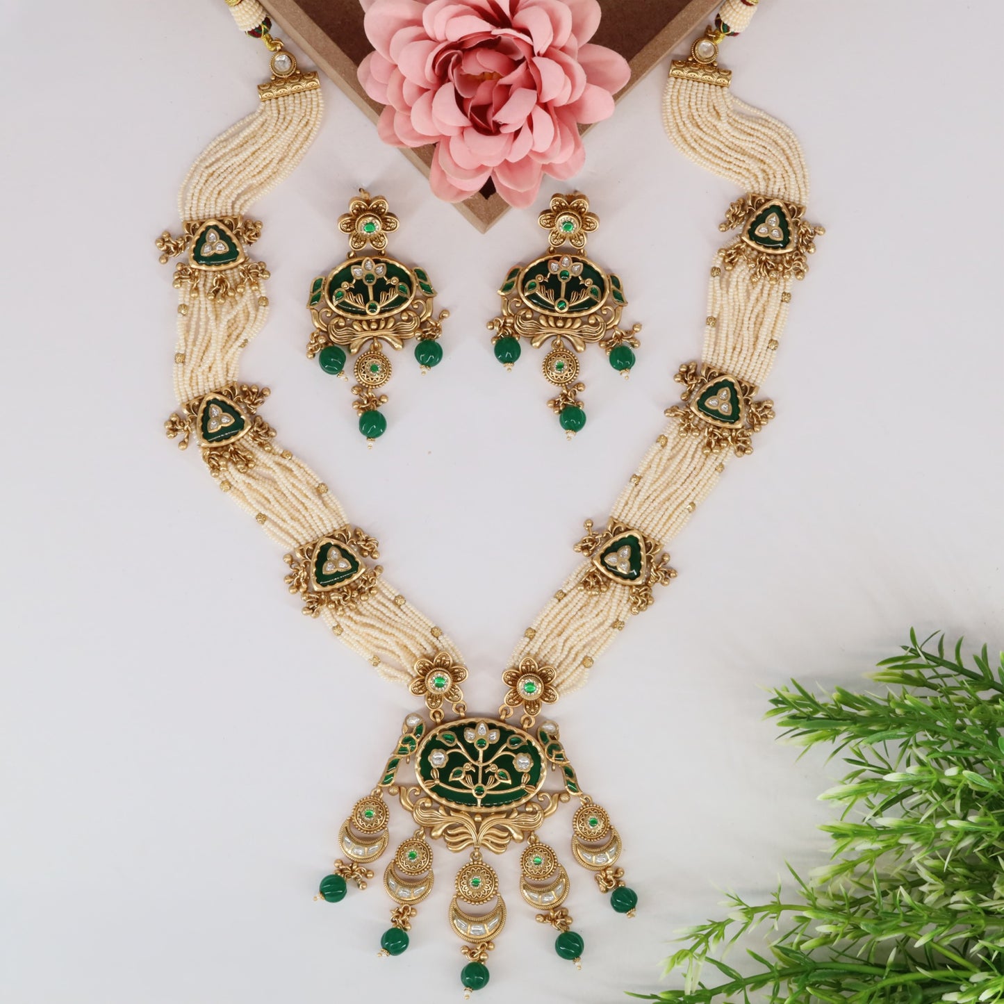 Floral framed Kundan long haara with intricate bead strands and pendant detailing