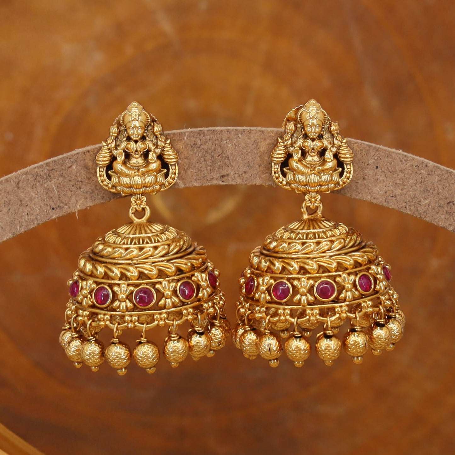 Traditional jumka with deity top and circular dome with bead drops