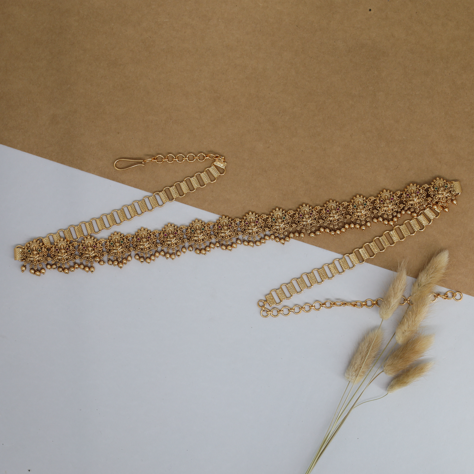 Radiant Lakshmi waist belt with repeating floral panels and bead drop fringe