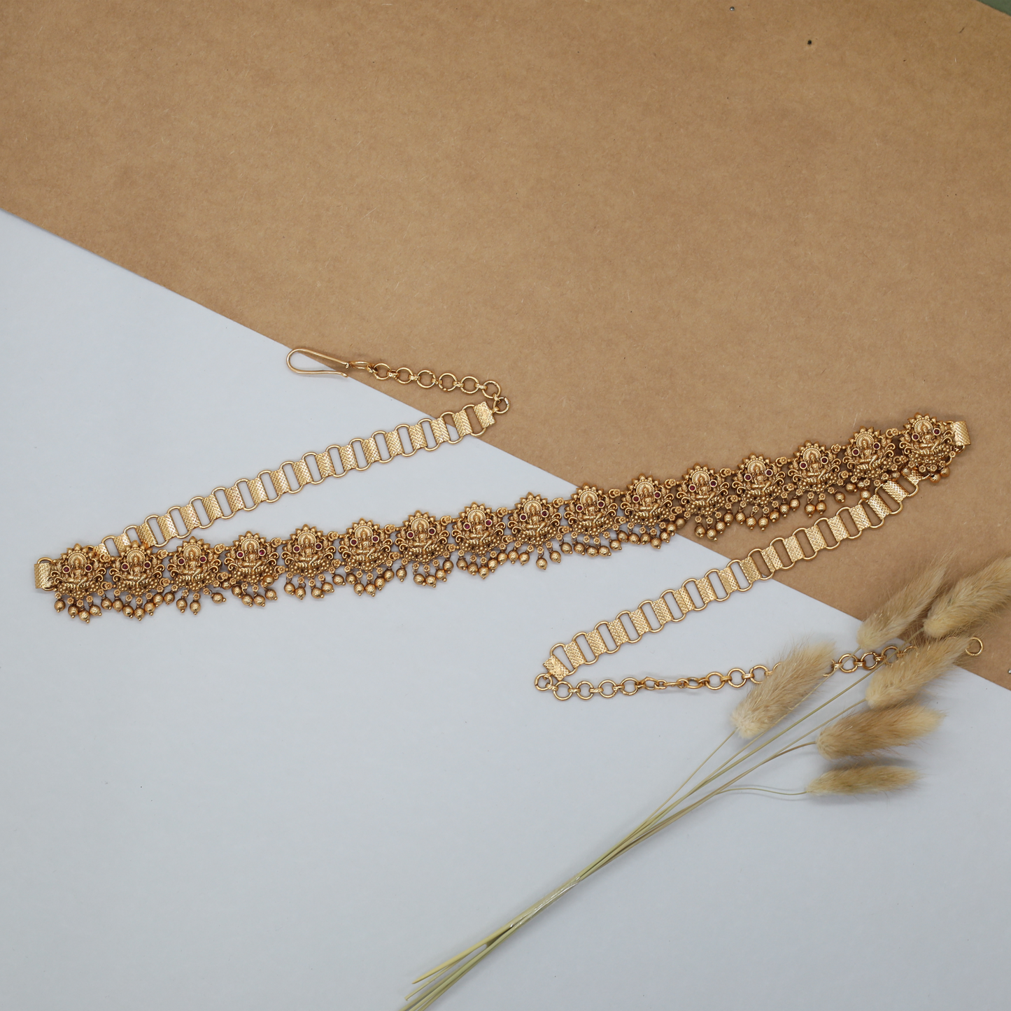 Radiant Lakshmi waist belt with repeating floral panels and bead drop fringe