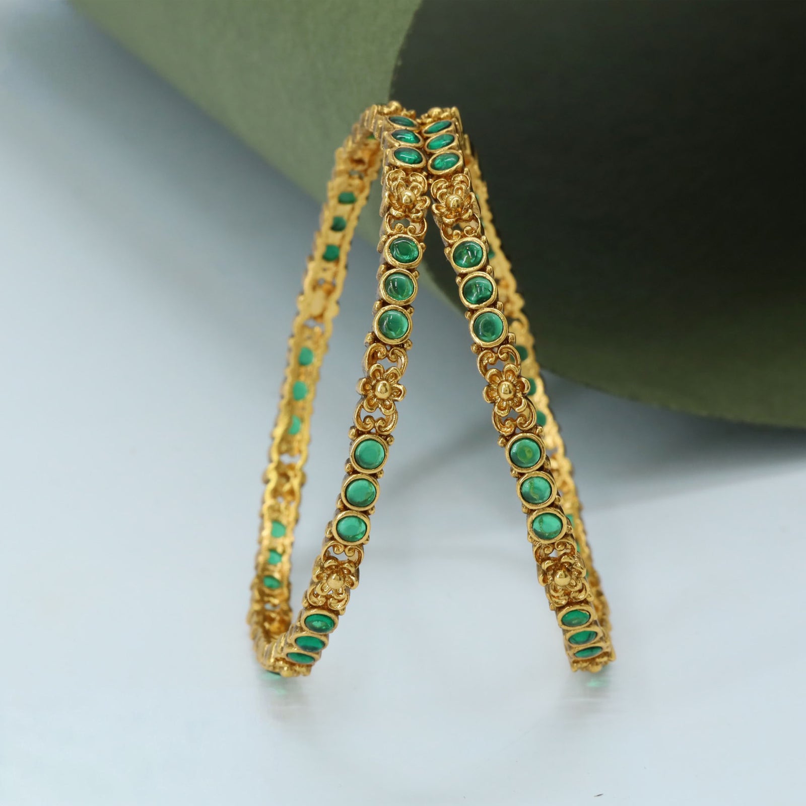 Oval Setting Bangles with Repeating Units and Carved Side Detailing