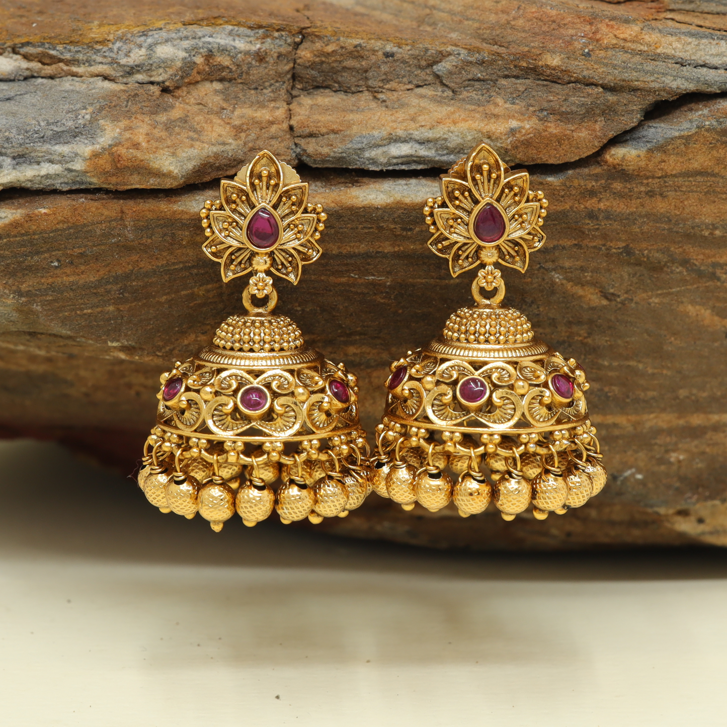 Floral Spread Stud Jumka with Carved Dome Form and Continuous Bead Hangings