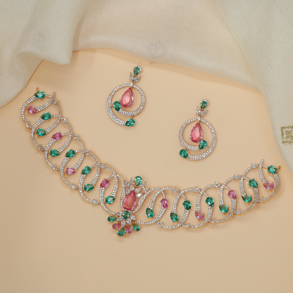 Rose gold crystal necklace with an artistic sequence of interlocking loops