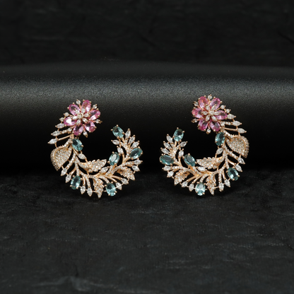 Rose gold floral studs with a distinctive curved profile