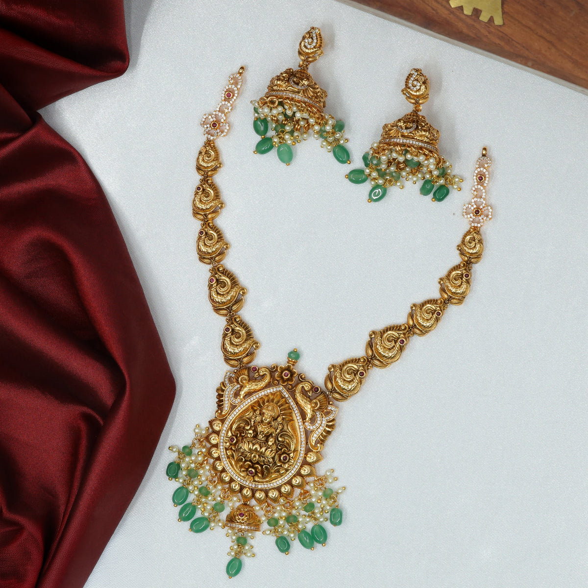 Sculpted Antique Necklace Featuring A Detailed Central Deity