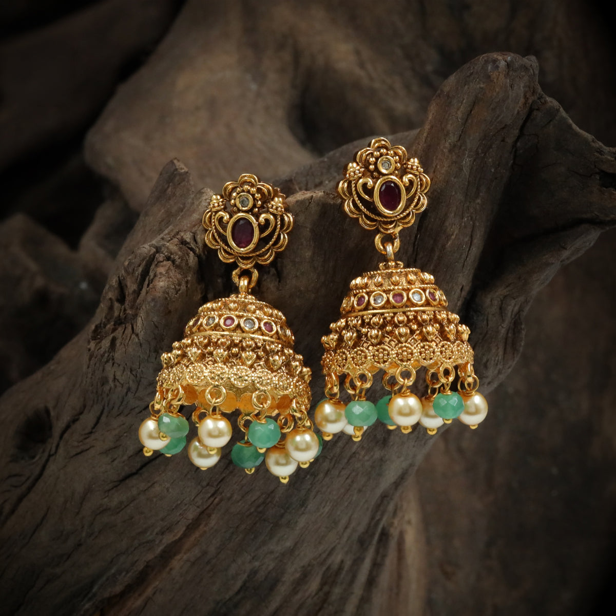 Traditional Antique Jumka Featuring Ornamental Floral Studs