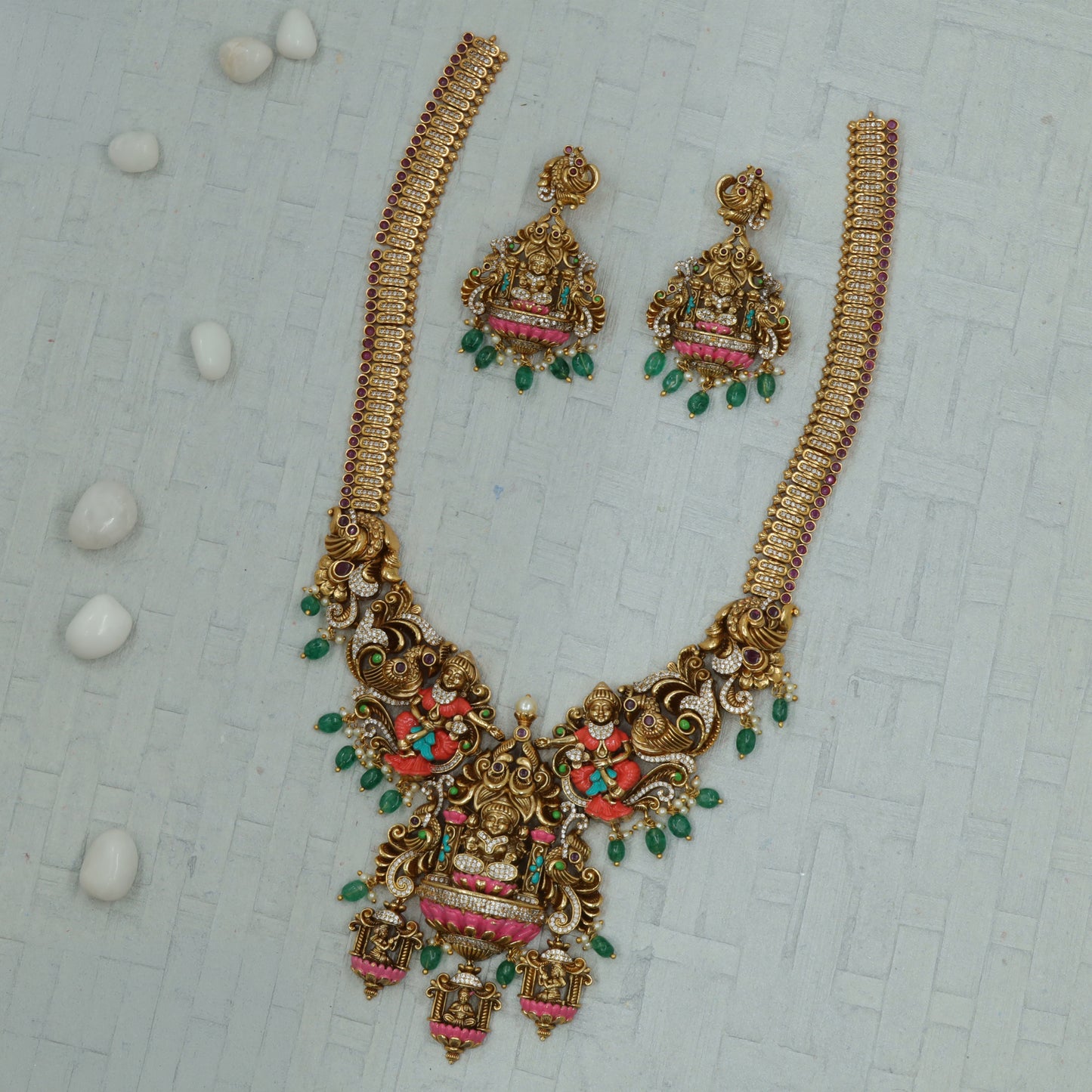 Antique haara featuring a grand central goddess pendant and ornamental peacock sections