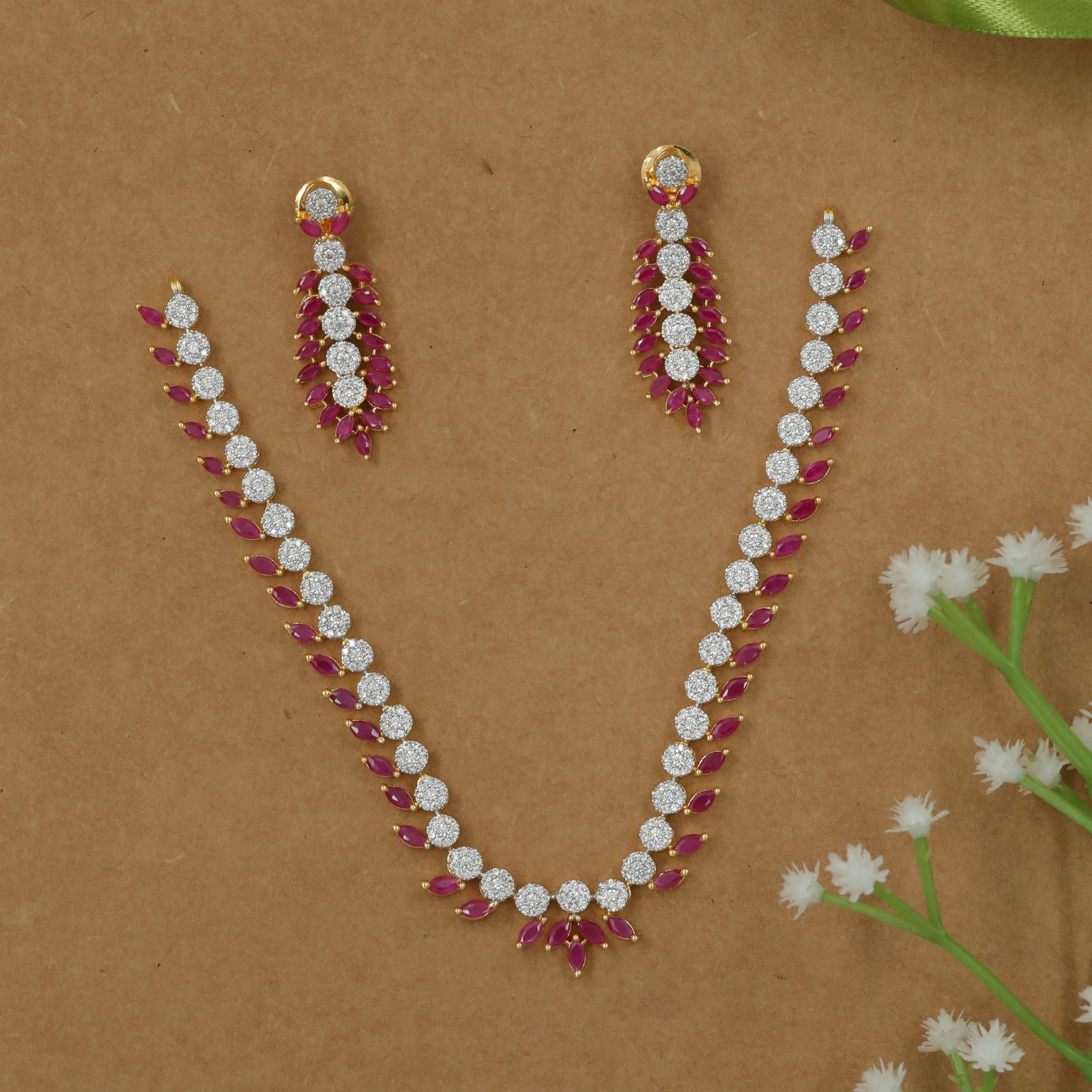 Sculpted Necklace with Repeating Circular Stations and Leaf Accents