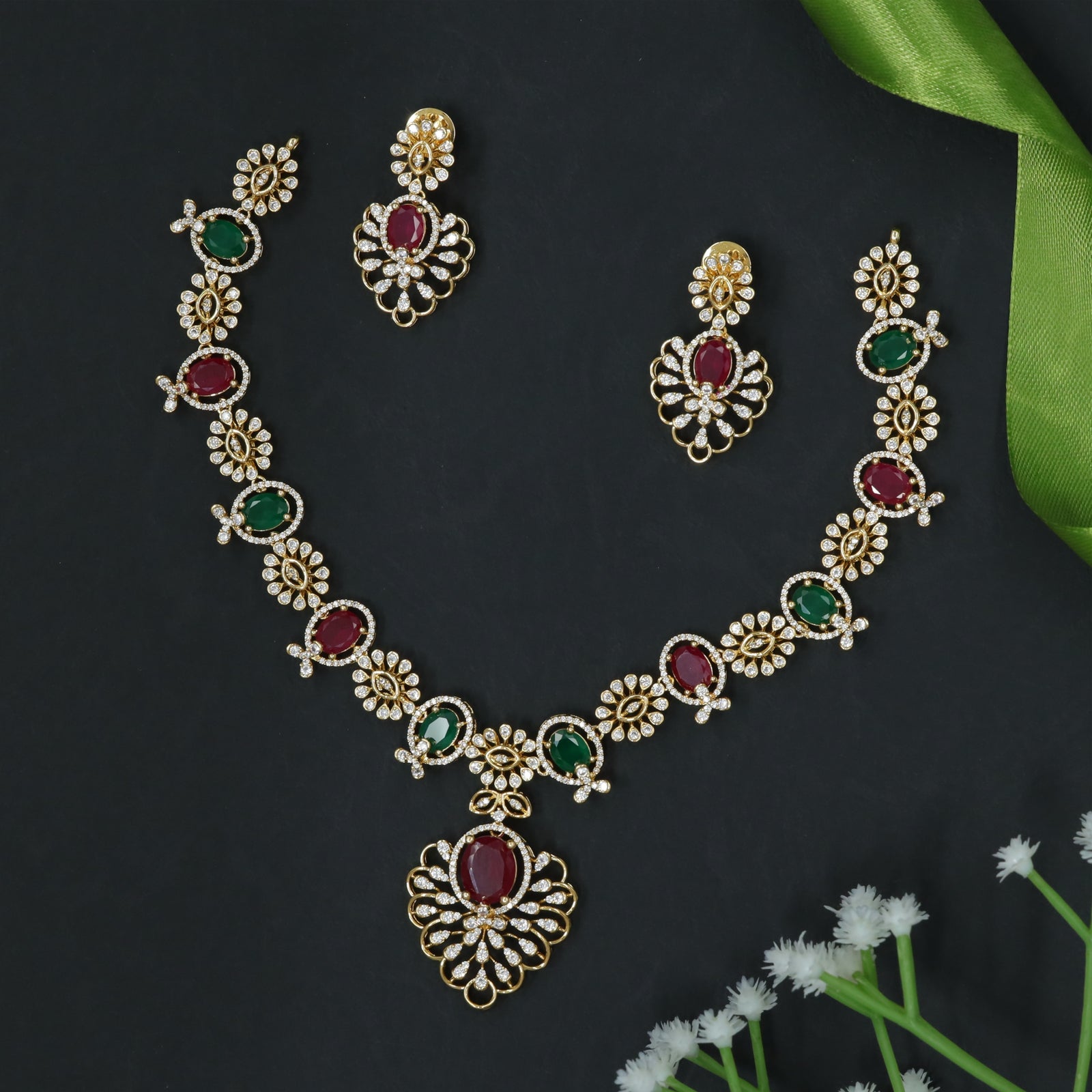 Intricately Designed Necklace with Floral Links and Oval Stone Accents