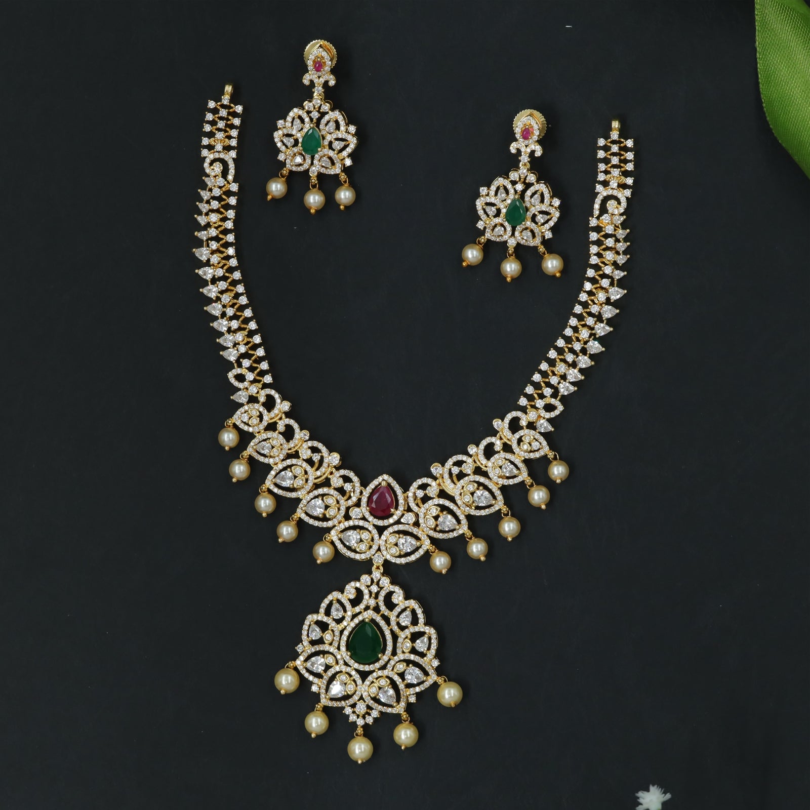 Stone-Rich Necklace with Central Drop Pendant and Fringe Accents