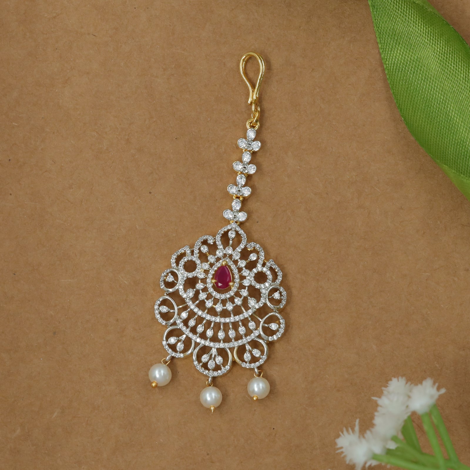 Detailed Lattice Flower Design Tikka with Balanced Pearl Ends