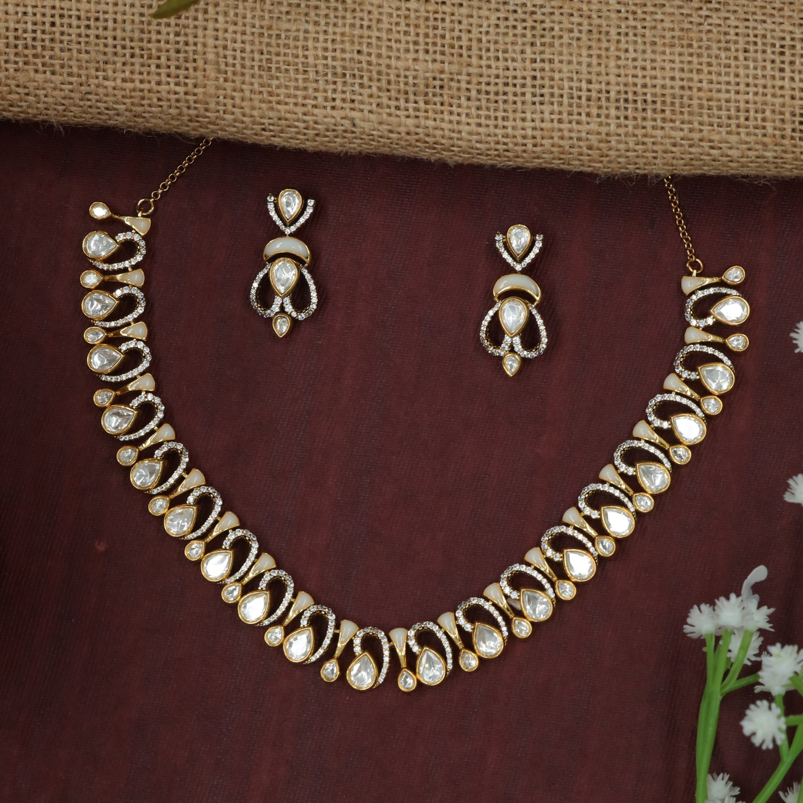Crescent-Flow Necklace with Repeated Tear Drop Design