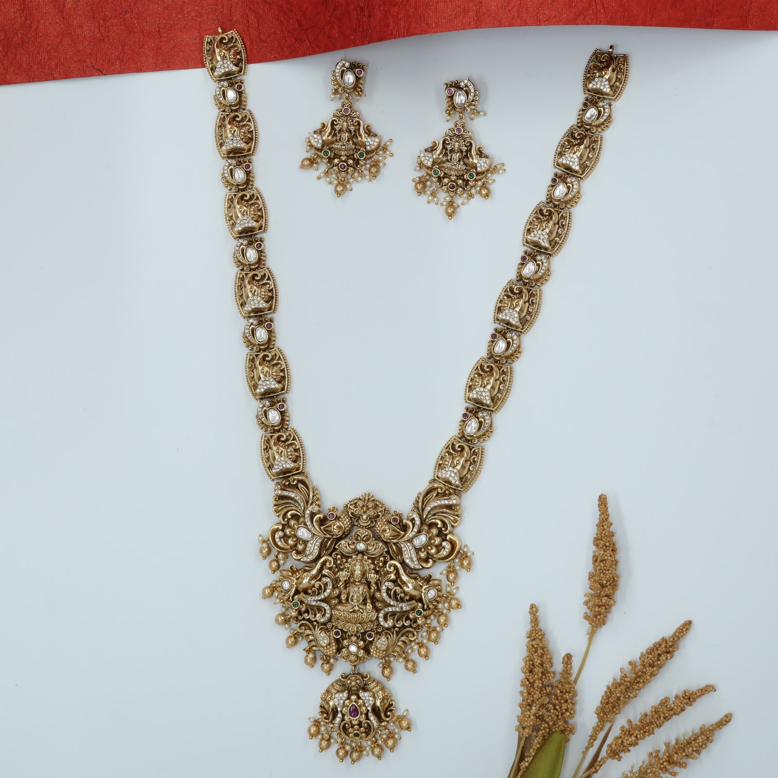 Sri Lakshmi Centre Long Haara with Gaja Relief Links and Mayura Crest Drops