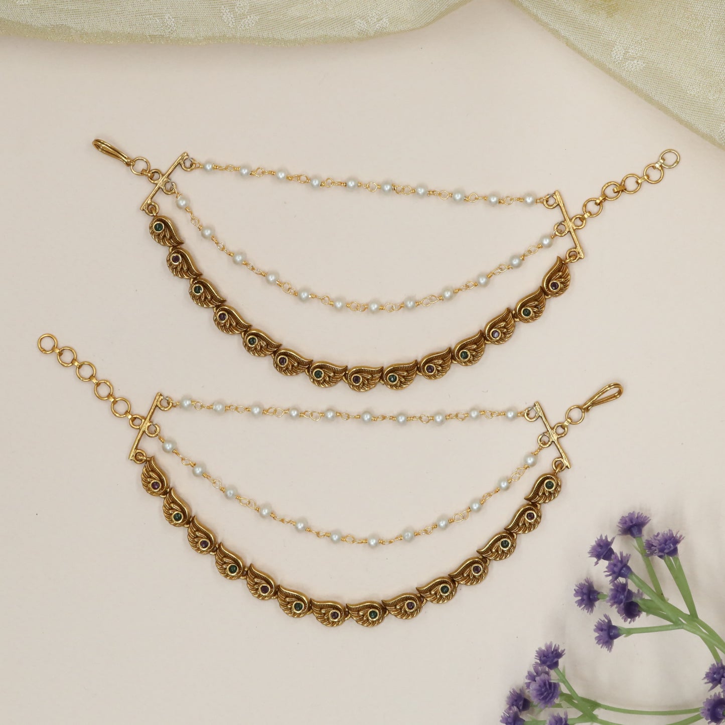 Peacock-Feather Mati with Repeating Winged Links and Stone Centres