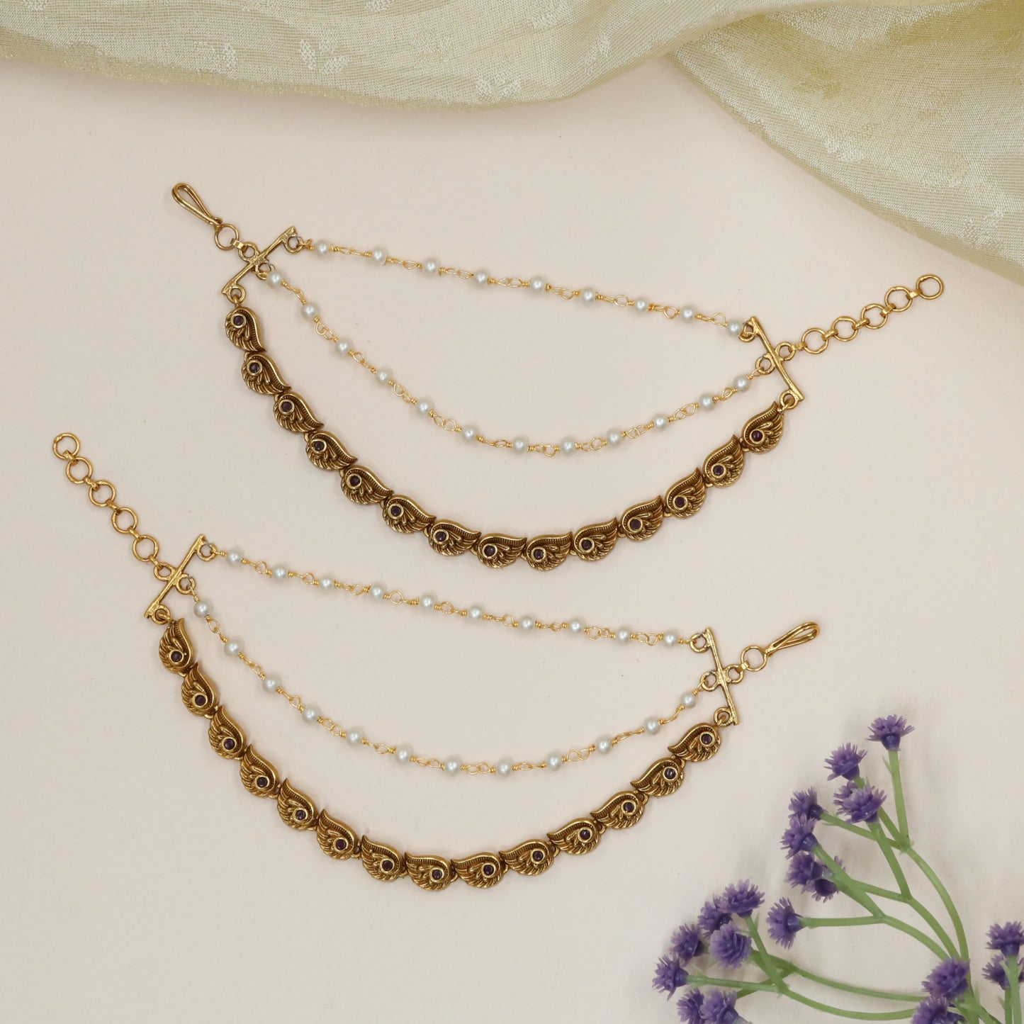 Peacock-Feather Mati with Repeating Winged Links and Stone Centres