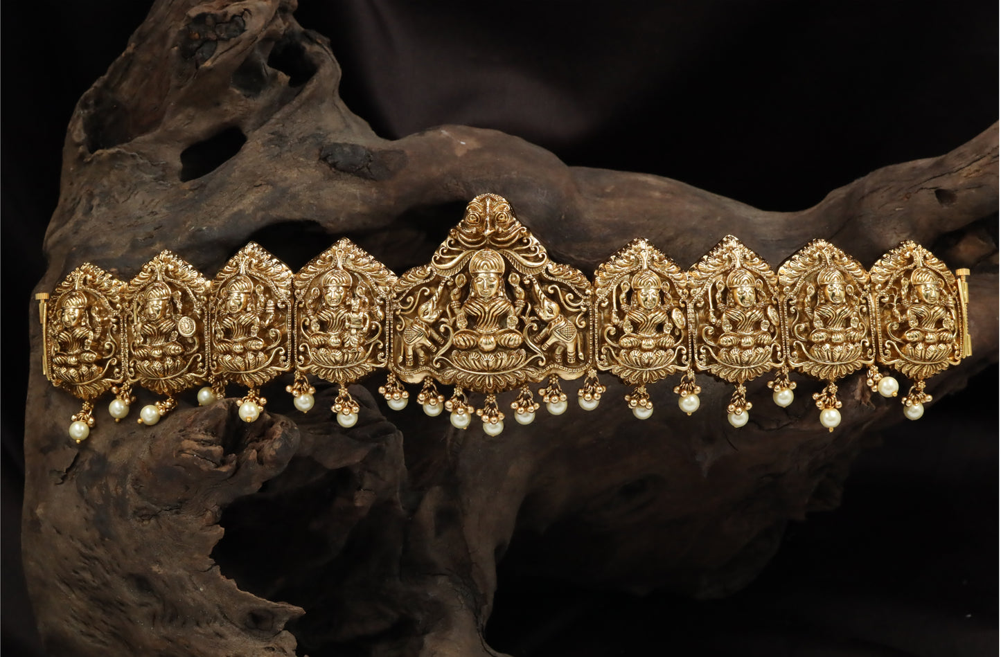 Arch-Form Dabu Featuring Seated Lakshmi with Repeating Shrine Links
