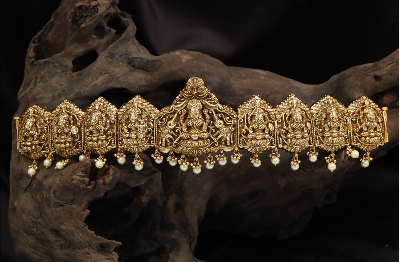 Arch-Form Dabu Featuring Seated Lakshmi with Repeating Shrine Links