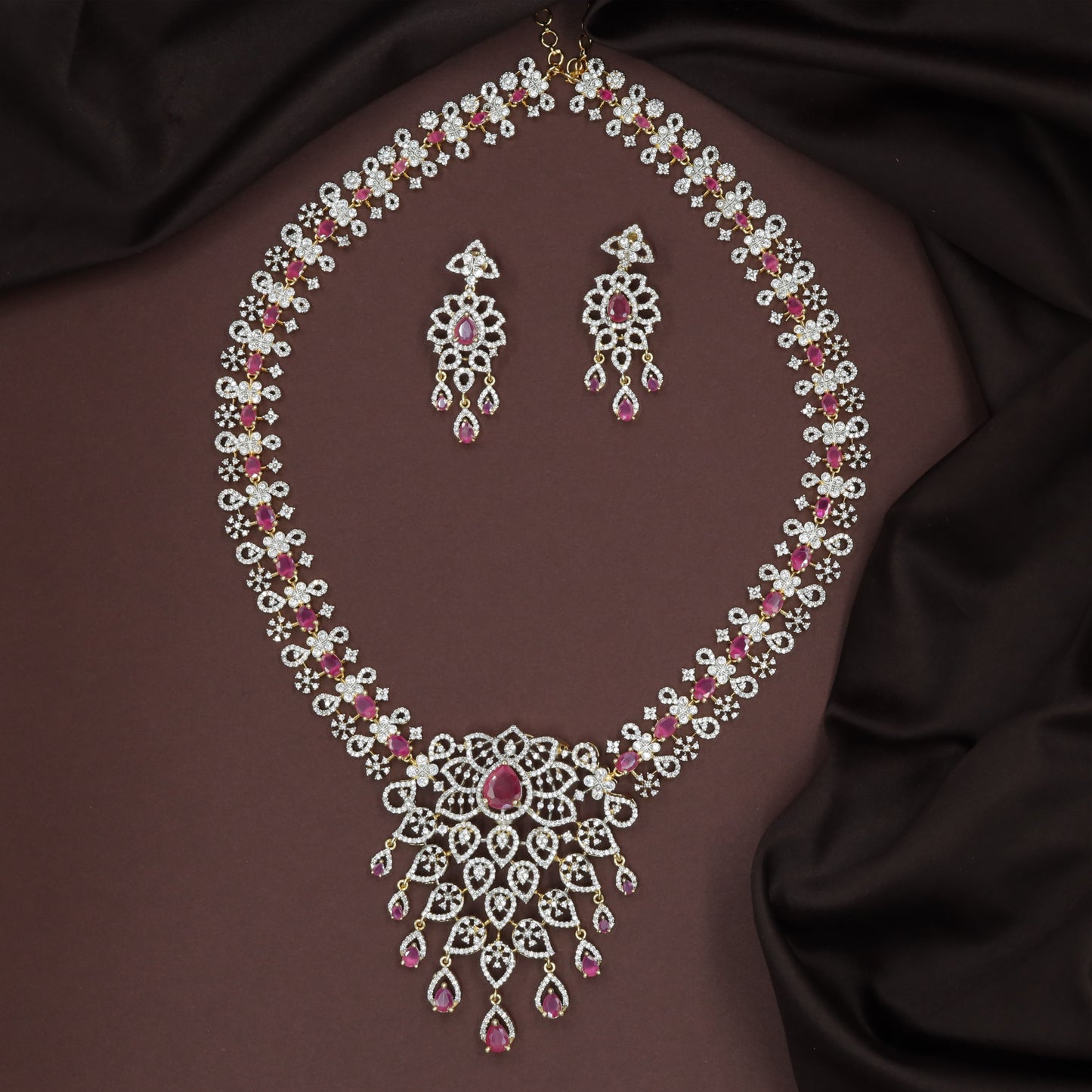 Repeating Floral Stone Links Forming a Long Haara with Expanded Drop Panel