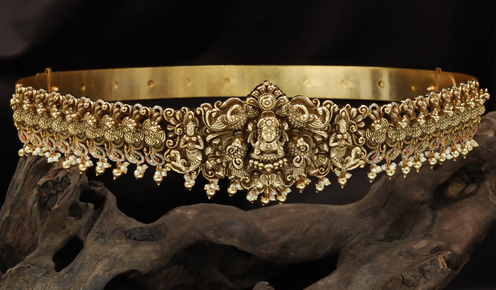 Antique Finish Lakshmi Dabu With Dense Ornamental Foliage And Drop Beads
