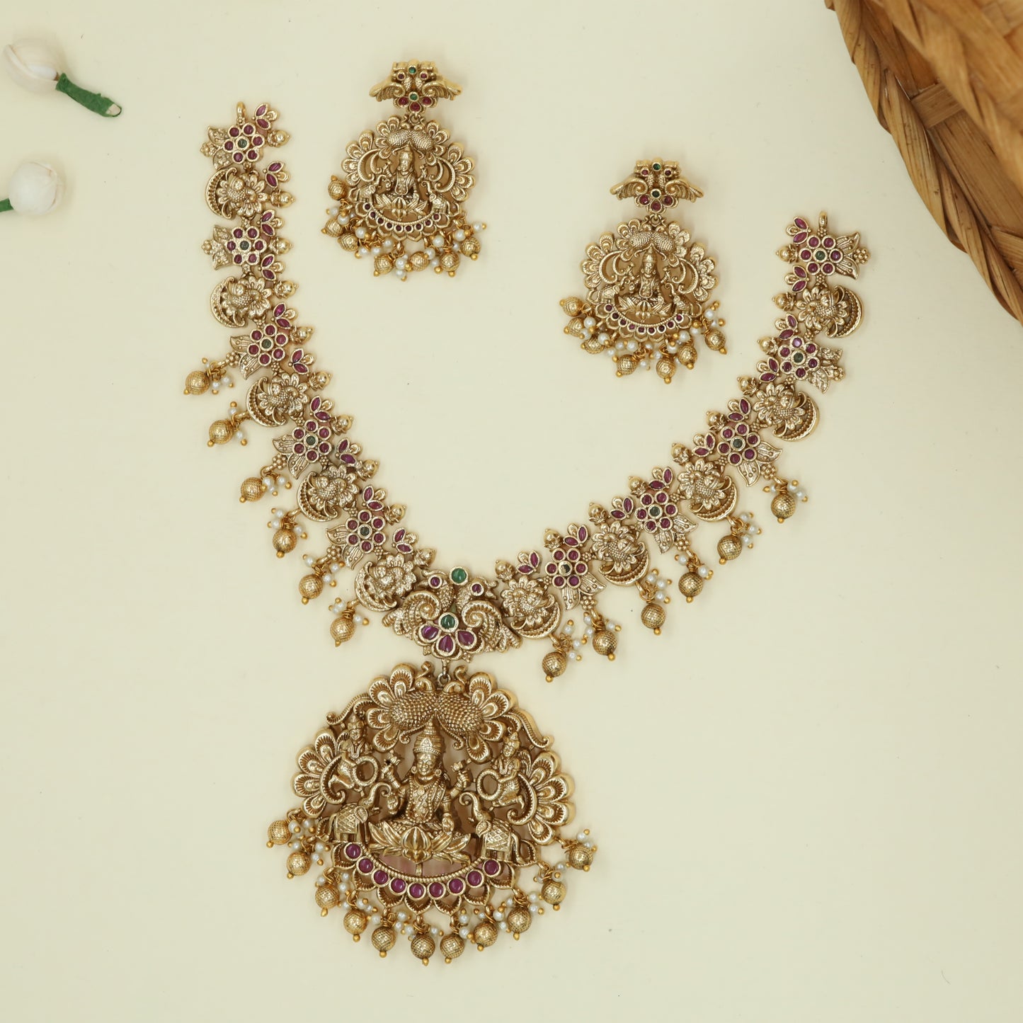 Elaborate Lakshmi Pendant Necklace with Ornamental Elephant Relief and Pearl Tassels