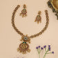 Divine Lakshmi Medallion Necklace with Floral Kundan Crest and Ruby Halo