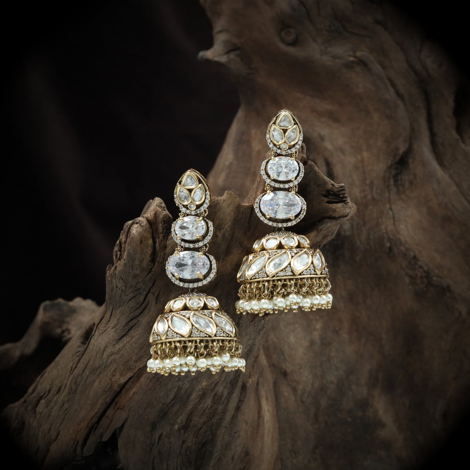 Triple oval cascade jumka with carved stone dome and bead border