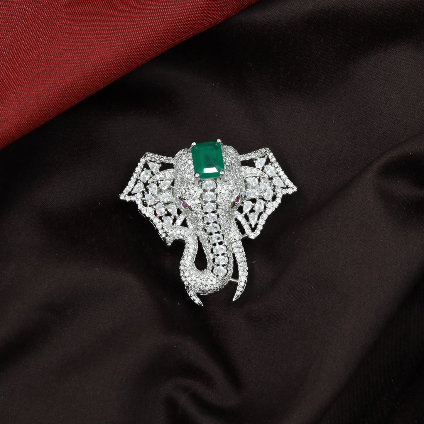 Bold elephant rhodium brooch with open lattice ear design