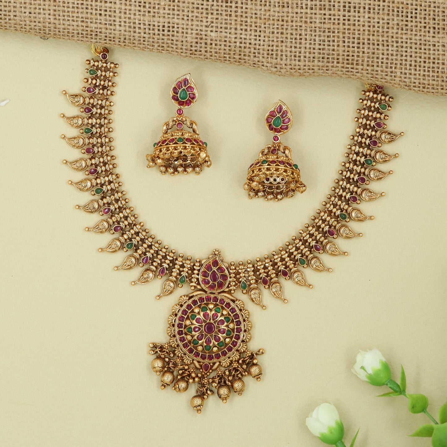 Granulated Edge Necklace with Round Floral Pendant and Dangling Drops