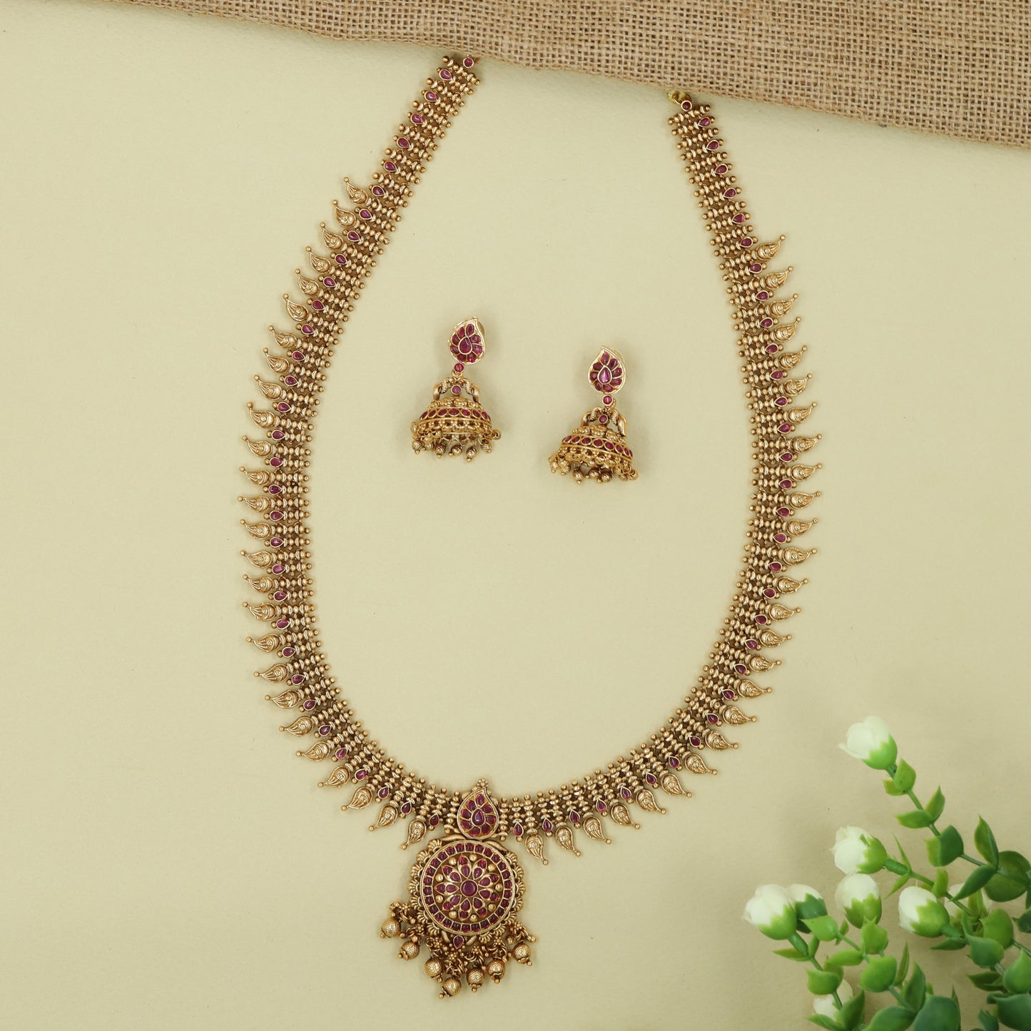 Curving Paisley Pattern Long Haara with Ornate Round Pendant