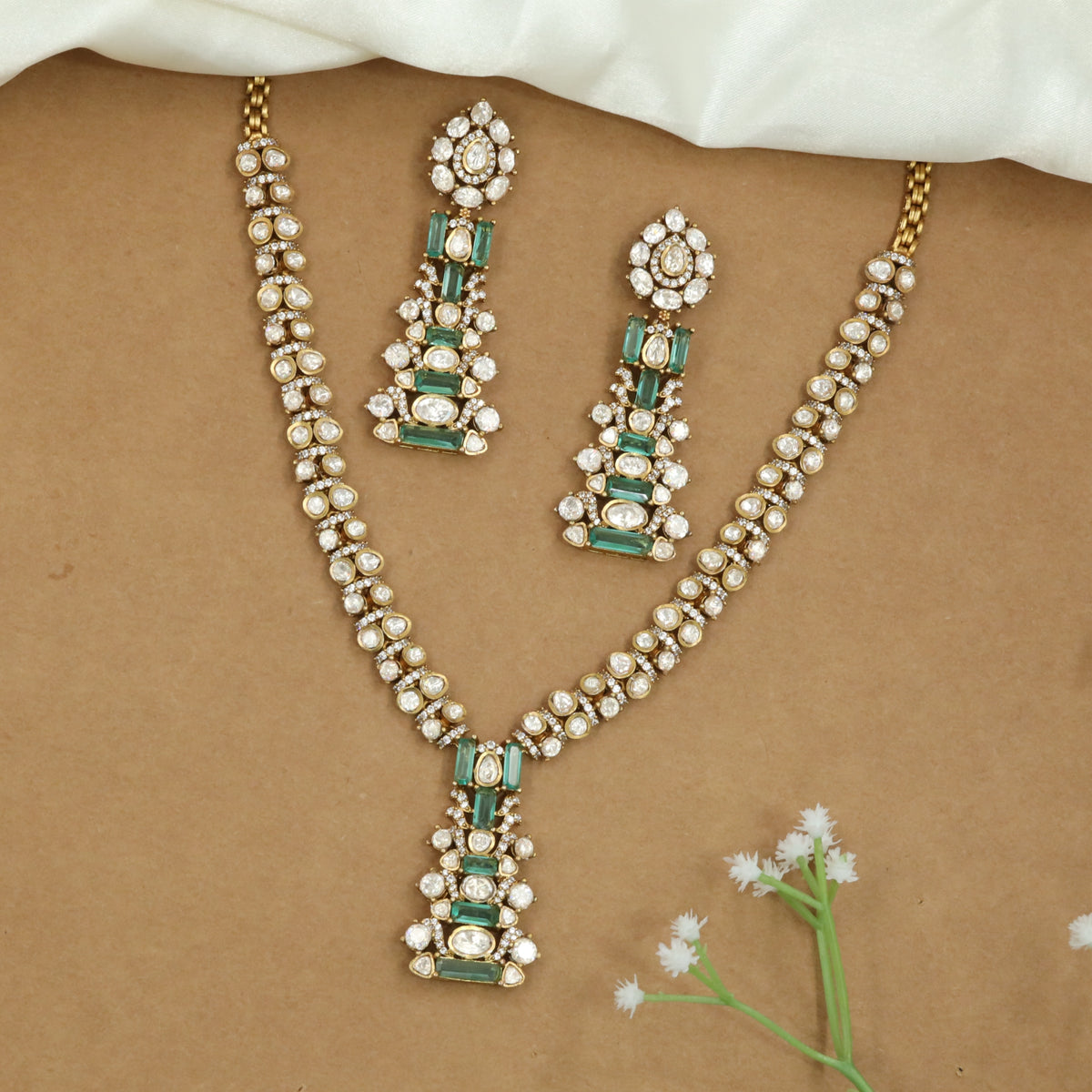 Linear Pattern Necklace with Repeating Units and Elongated Pendant Detail