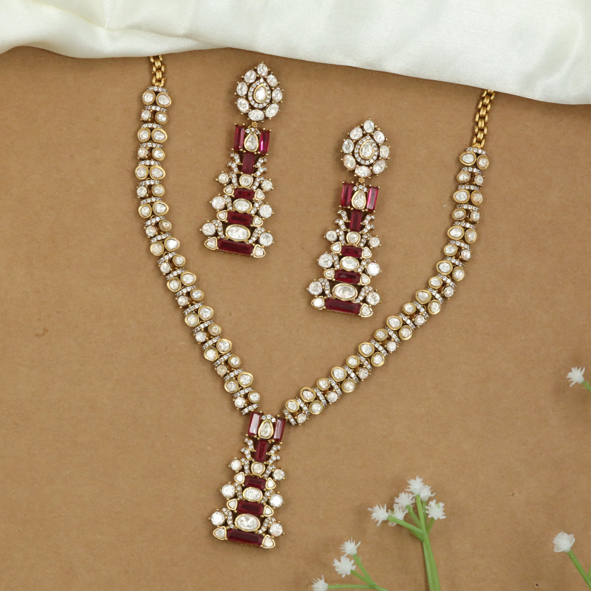 Linear Pattern Necklace with Repeating Units and Elongated Pendant Detail