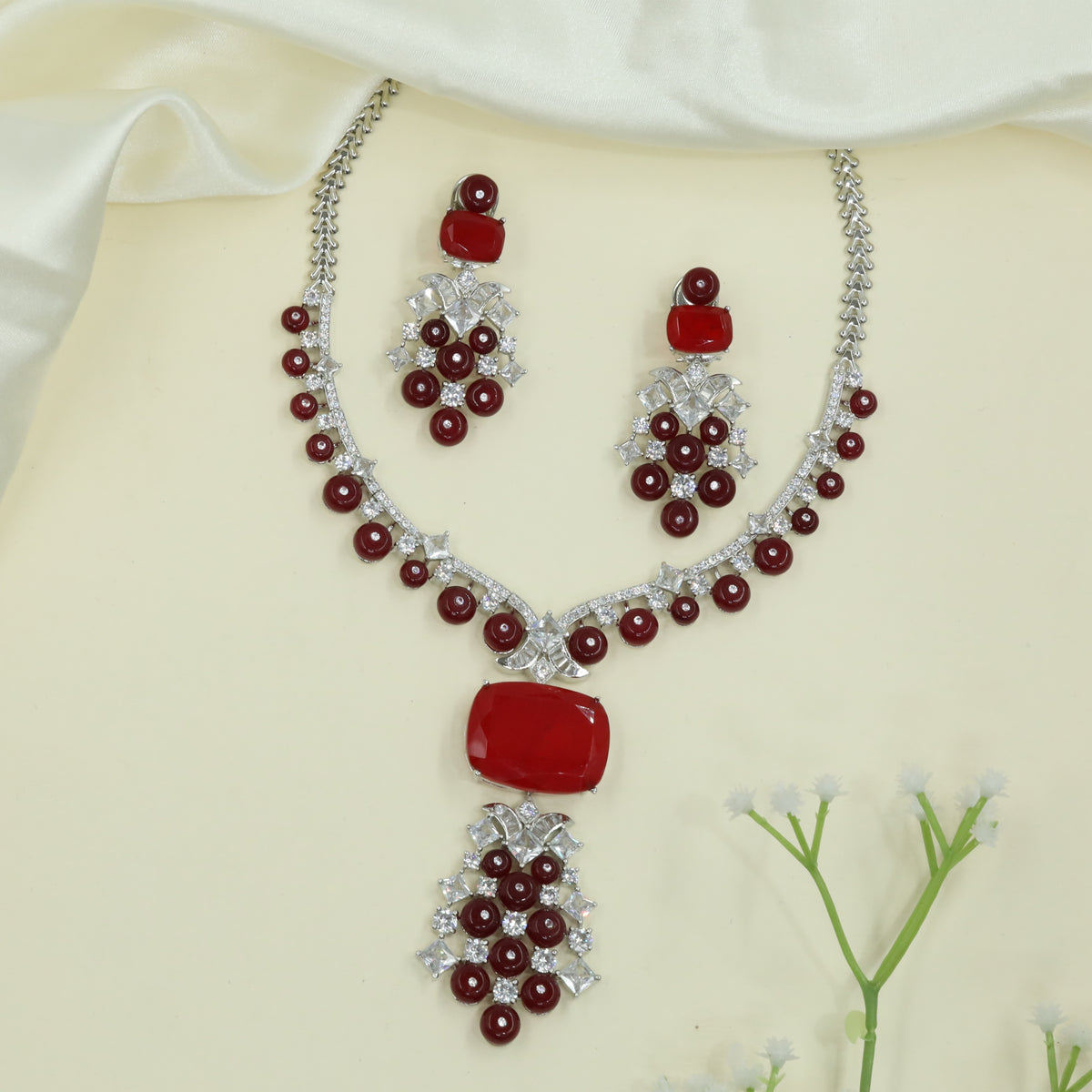 Refined Arc Design Necklace with Repeating Round Drops and Structured Centerpiece
