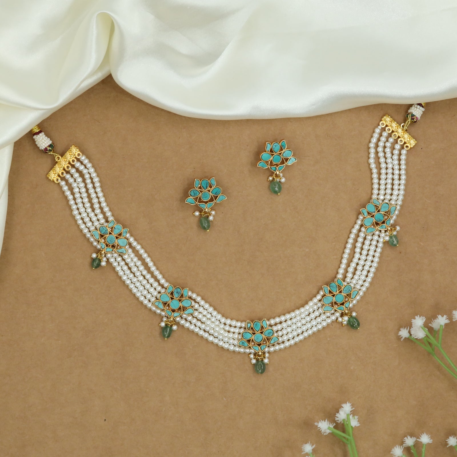 Flowing Multi Strand Pearl Choker with Floral Connectors and Drop Hangings