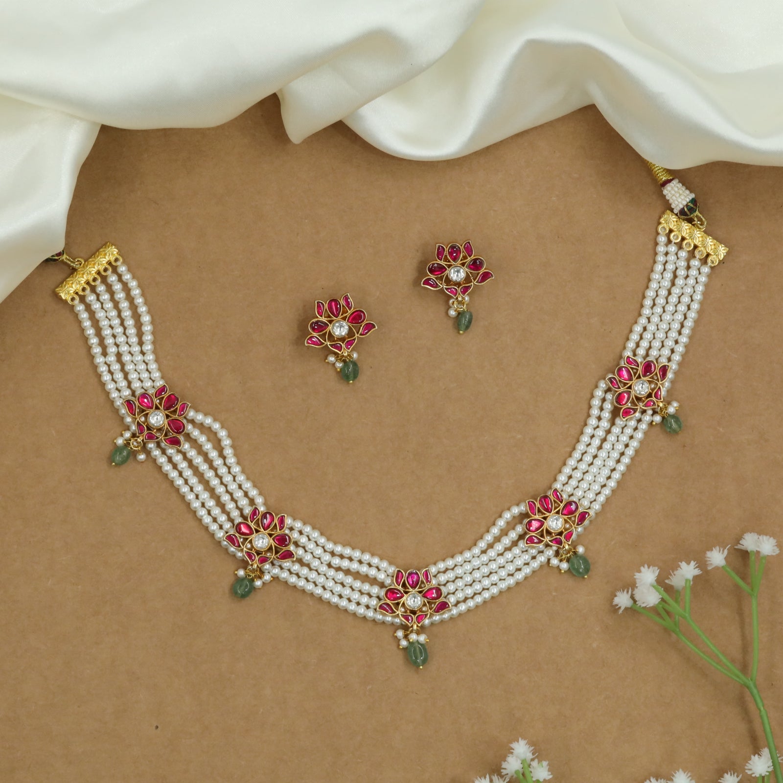 Flowing Multi Strand Pearl Choker with Floral Connectors and Drop Hangings