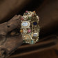 Oval Centre Kundan Bangles with Floral Cluster Detailing and Raised Frames