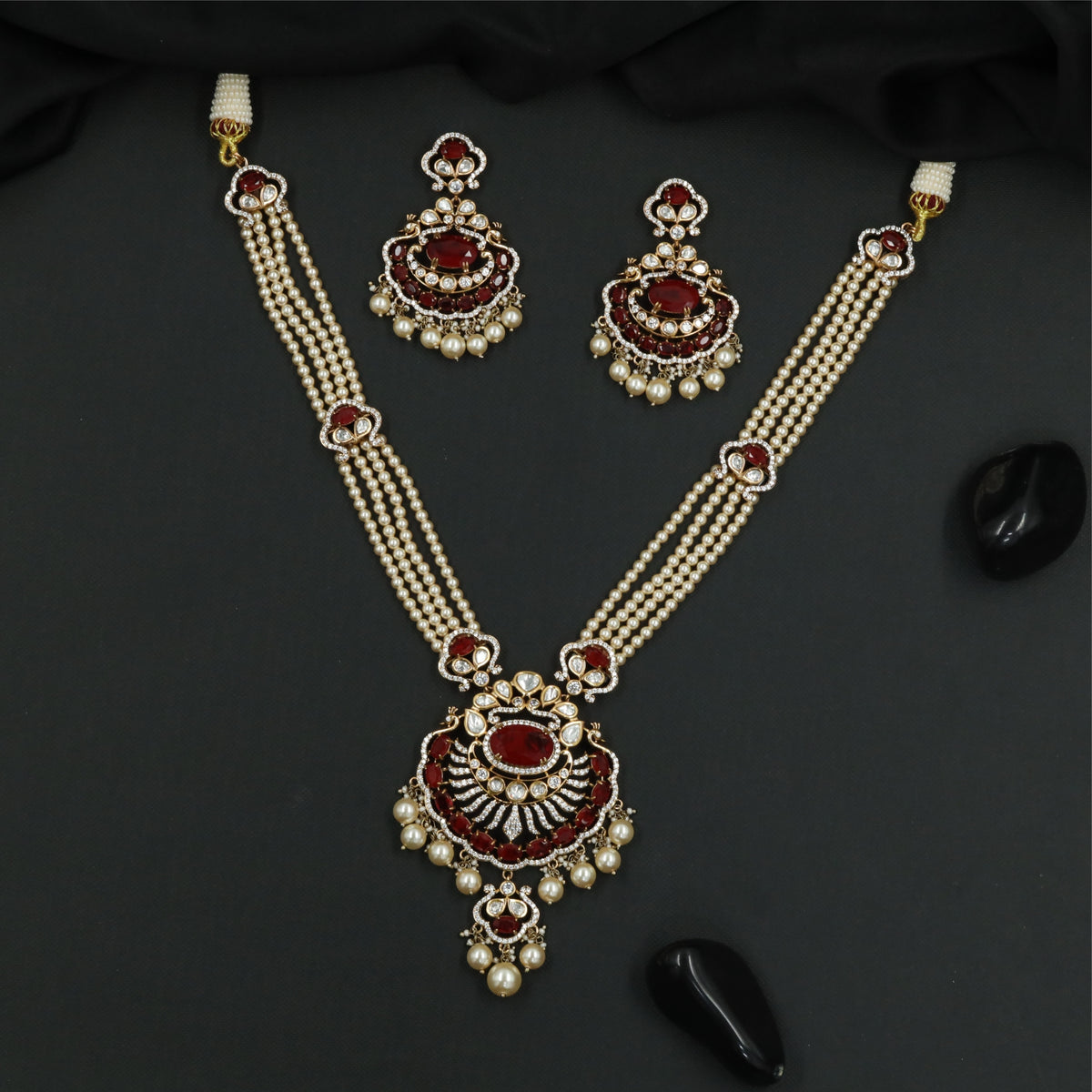Articulated Multi Strand Kundan Pearl Necklace with Circular Pendant and Pearl Danglers
