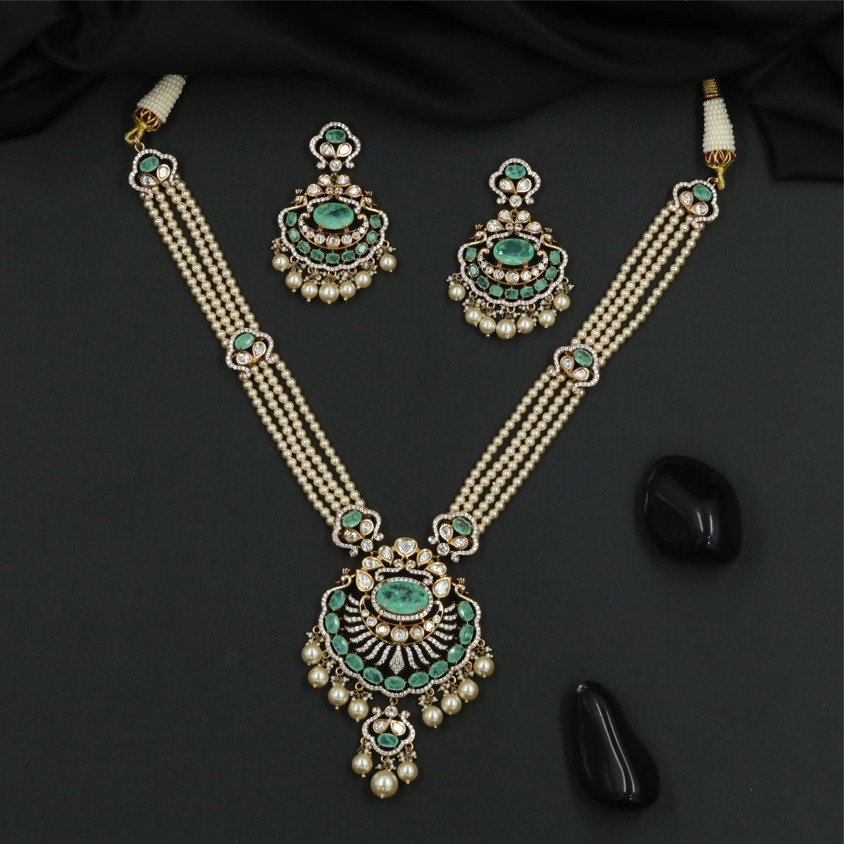 Articulated Multi Strand Kundan Pearl Necklace with Circular Pendant and Pearl Danglers