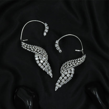 Feather curve Ear bluetooth with sweeping form and dense stone arrangement