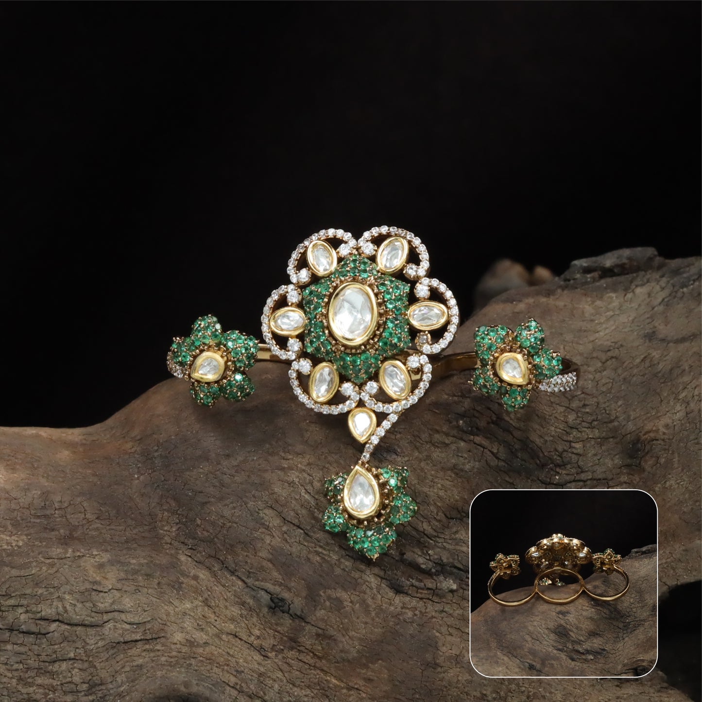 Connected floral kundan finger ring with central cluster and side petal forms with hanging drop