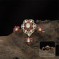 Connected floral kundan finger ring with central cluster and side petal forms with hanging drop