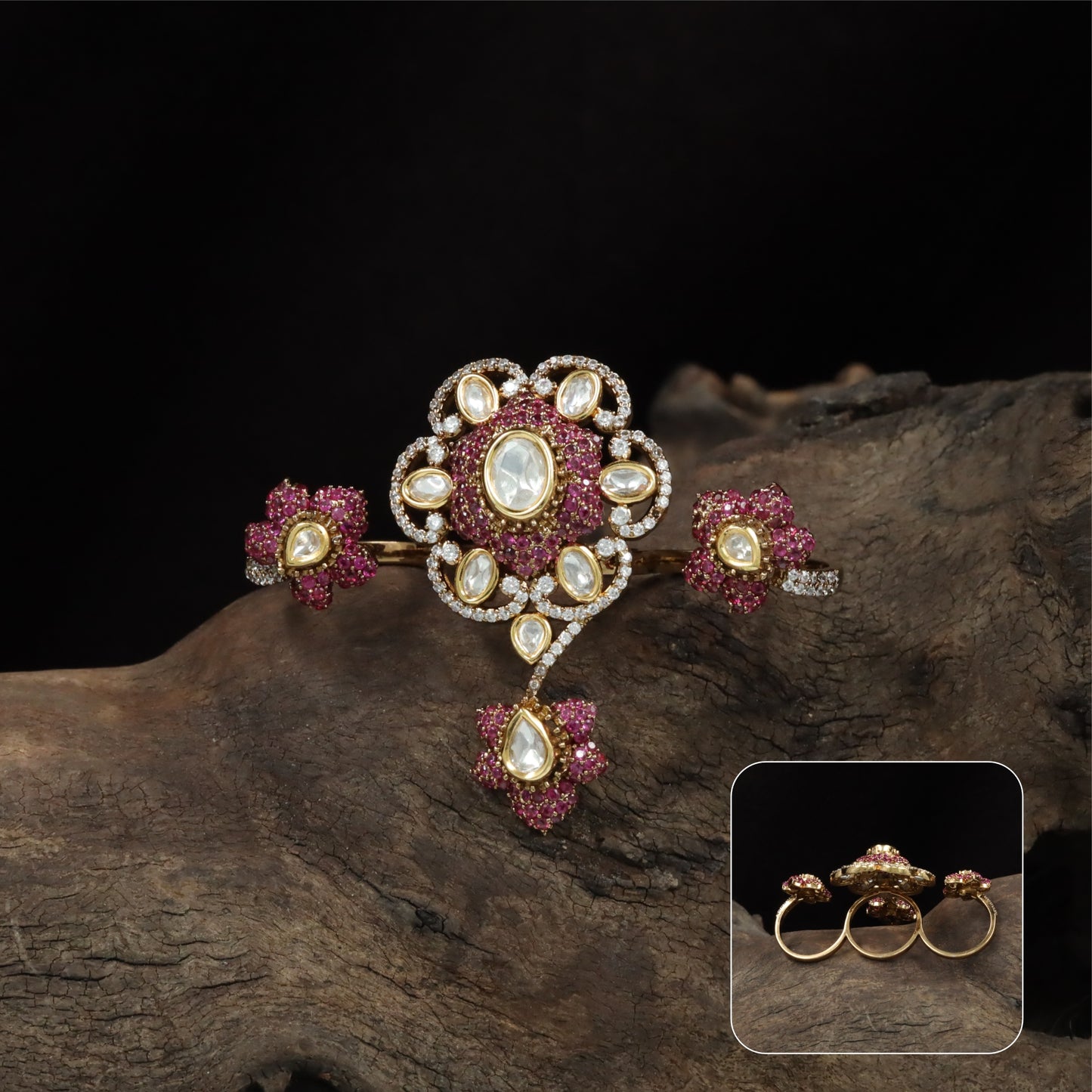 Connected floral kundan finger ring with central cluster and side petal forms with hanging drop