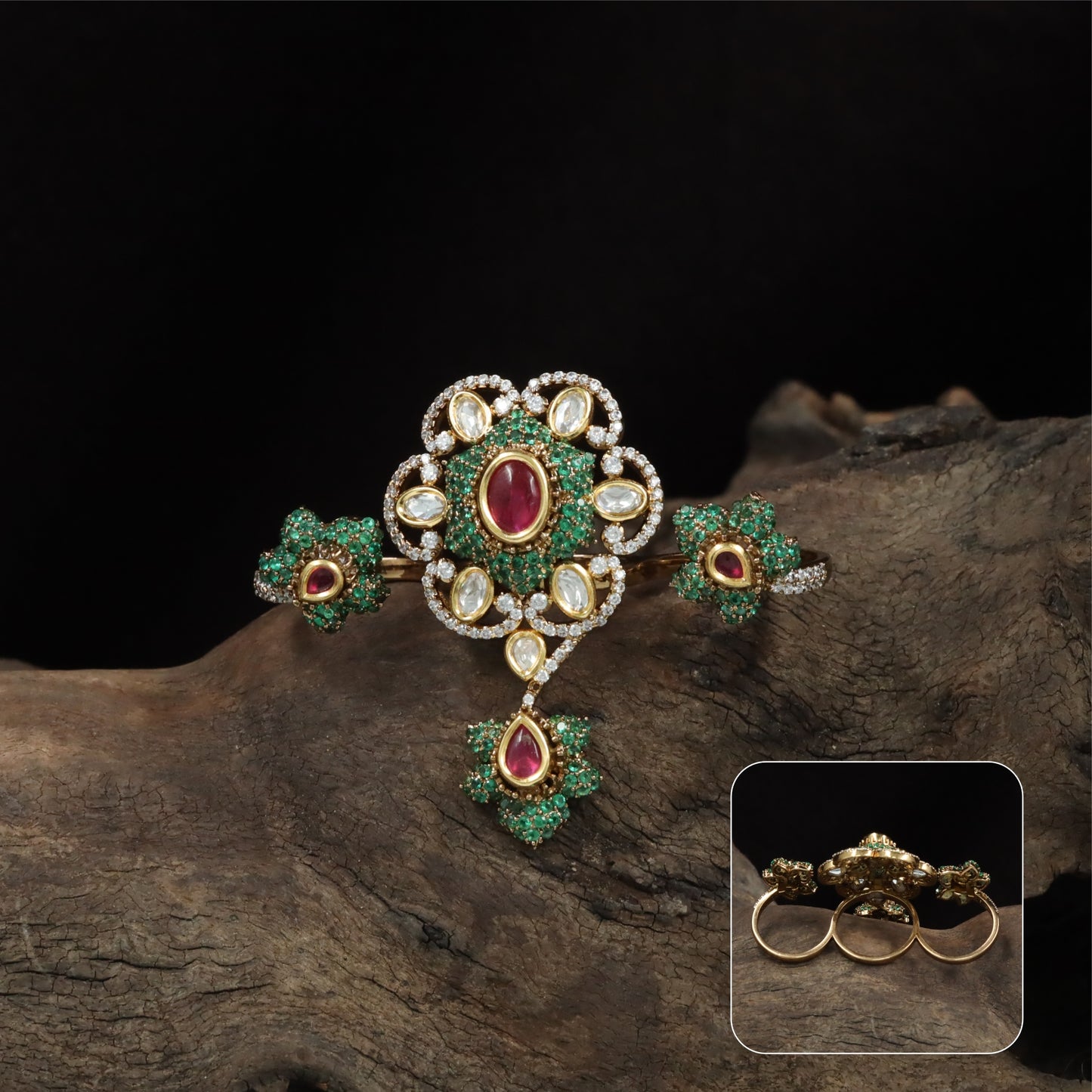 Connected floral kundan finger ring with central cluster and side petal forms with hanging drop