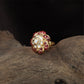 Floral centre kundan finger ring with circular core and surrounding petal segments