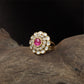 Central bloom kundan finger ring with scalloped round core and surrounding oval units