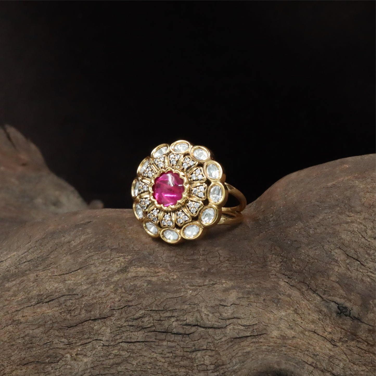 Central bloom kundan finger ring with scalloped round core and surrounding oval units