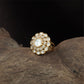 Central bloom kundan finger ring with scalloped round core and surrounding oval units